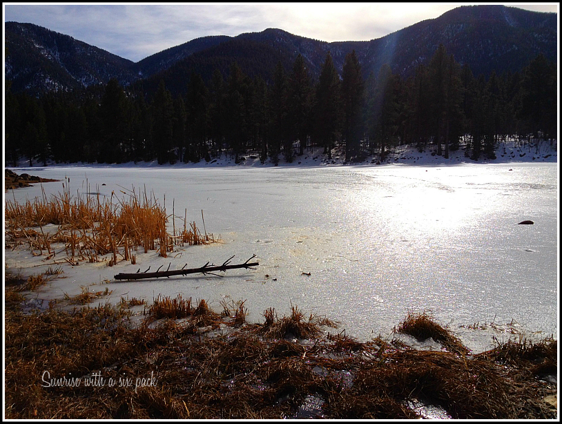 Sun over a frozen lake